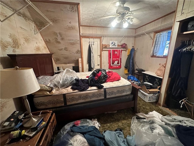 bedroom featuring wood walls