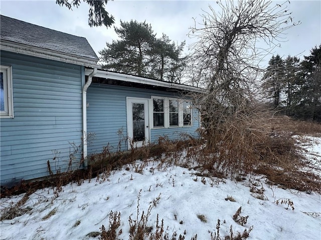 view of snow covered property