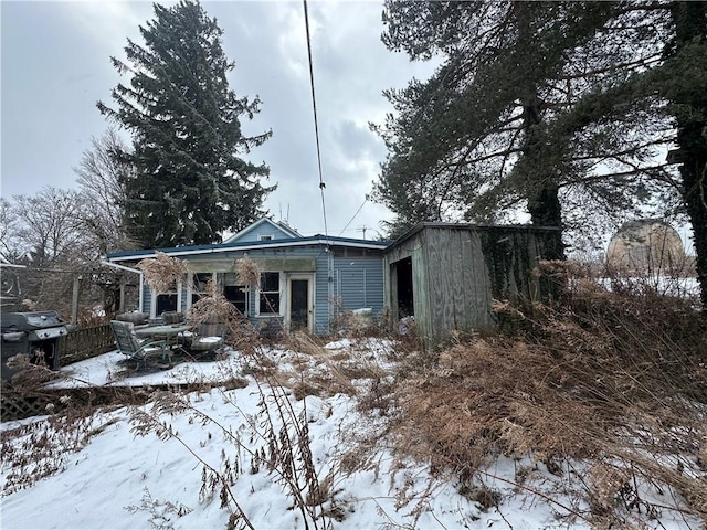 view of snow covered house