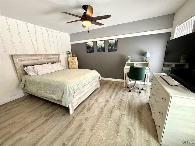 bedroom with ceiling fan and light hardwood / wood-style floors