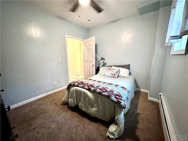 bedroom featuring baseboard heating, ceiling fan, and dark carpet