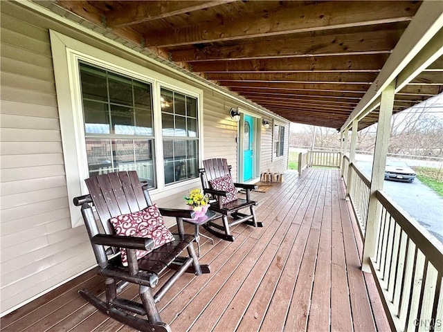 wooden terrace featuring a porch