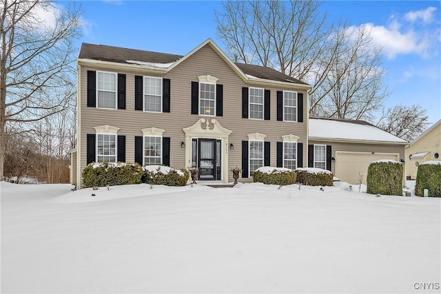 colonial home featuring a garage