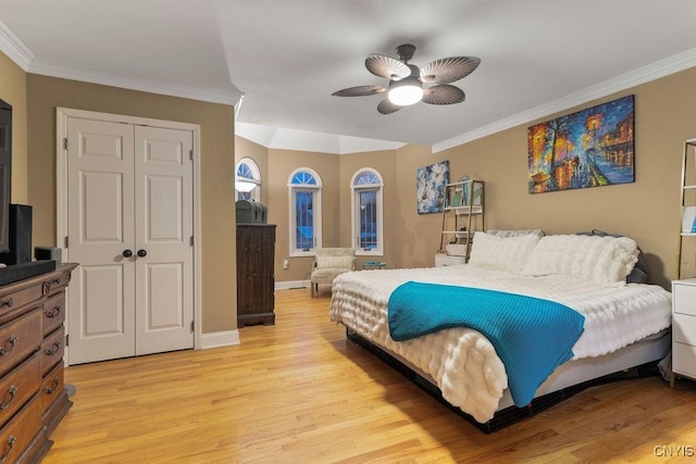 bedroom featuring crown molding, a closet, and light wood-type flooring