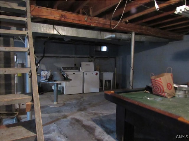 basement featuring sink and independent washer and dryer