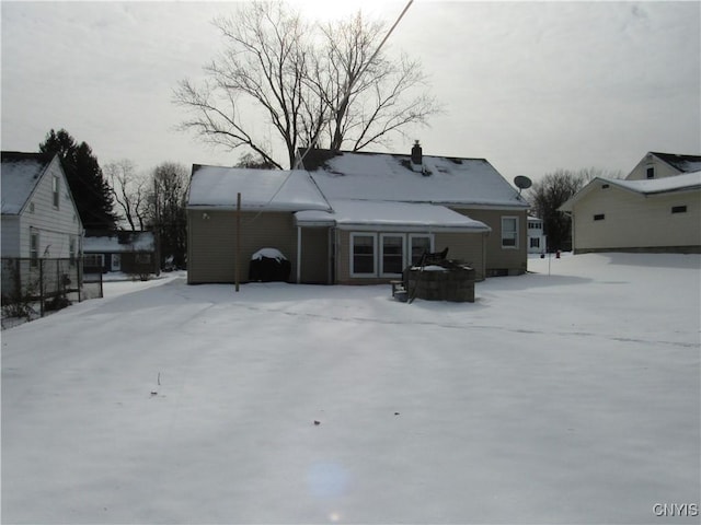 view of snow covered house