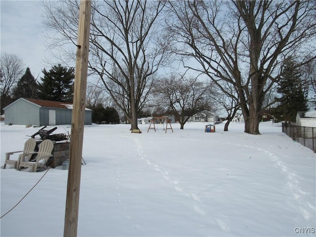 view of yard layered in snow