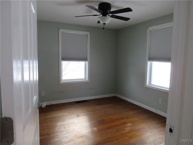 unfurnished room featuring hardwood / wood-style floors and ceiling fan