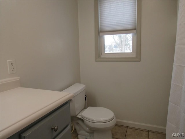 bathroom with vanity, tile patterned floors, and toilet