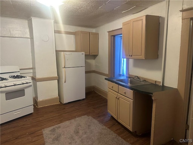 kitchen featuring sink, white appliances, dark hardwood / wood-style floors, and light brown cabinets