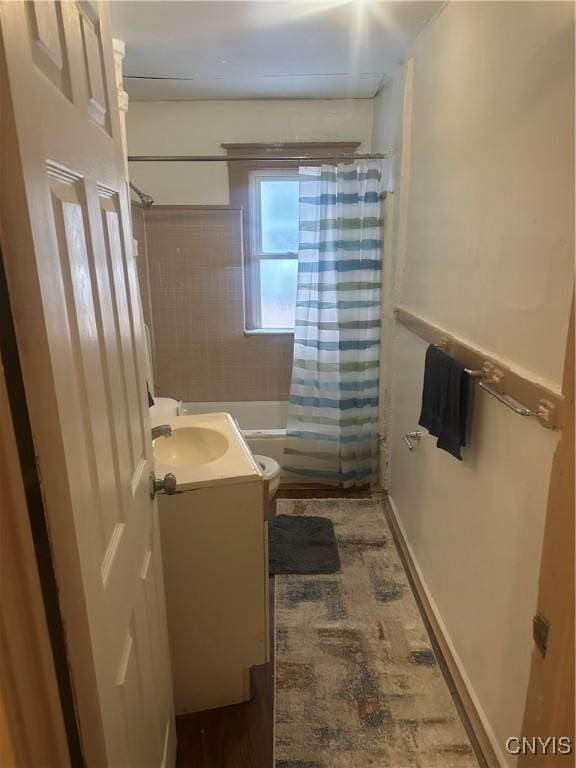 full bathroom with shower / bath combination with curtain, vanity, and toilet