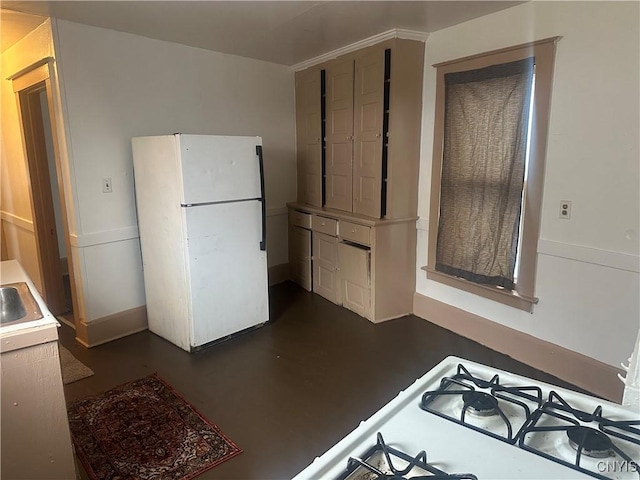 kitchen with sink and white refrigerator