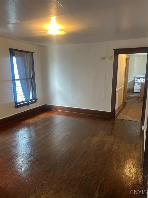 empty room featuring dark hardwood / wood-style floors