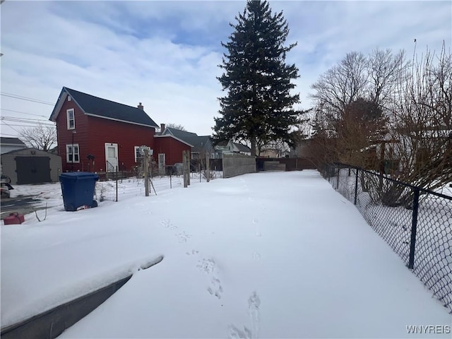 view of yard layered in snow