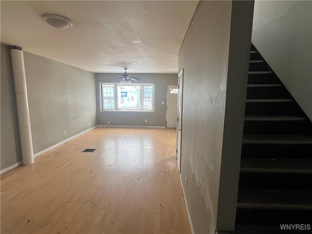 interior space with ceiling fan and light hardwood / wood-style flooring