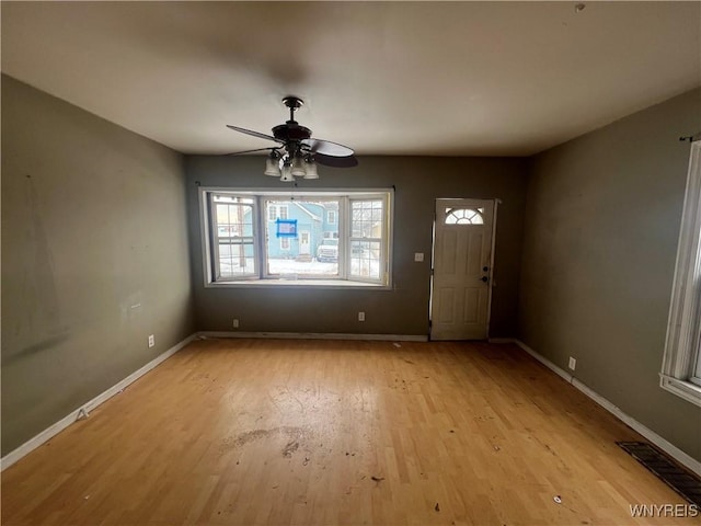 foyer entrance featuring light hardwood / wood-style floors and ceiling fan