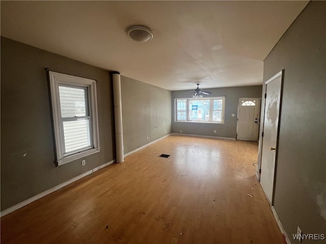 unfurnished room featuring ceiling fan and light hardwood / wood-style flooring