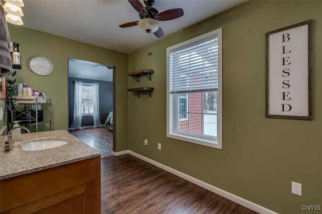 bathroom with vanity, wood-type flooring, and ceiling fan