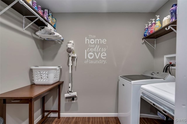 clothes washing area featuring dark hardwood / wood-style flooring and washing machine and clothes dryer