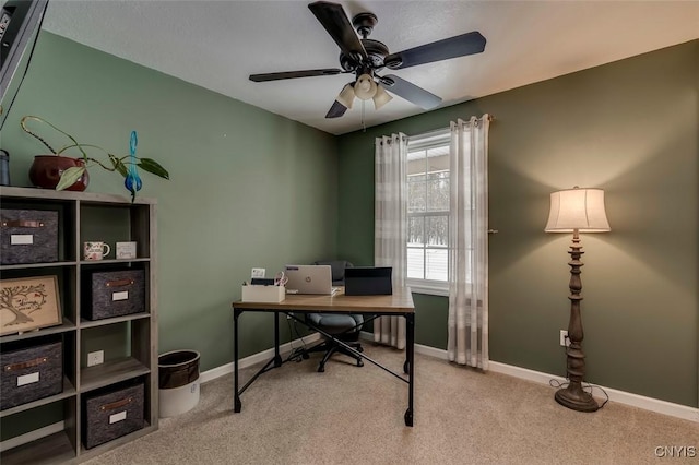 home office featuring ceiling fan and light colored carpet