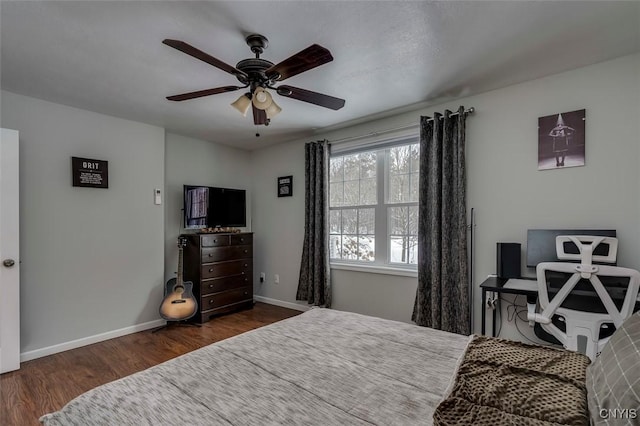 bedroom featuring ceiling fan and dark hardwood / wood-style flooring