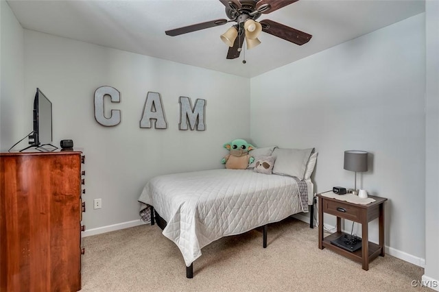 bedroom with light colored carpet and ceiling fan