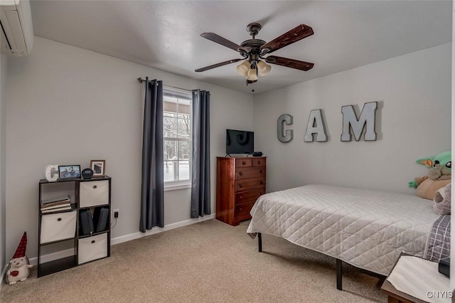 bedroom with ceiling fan, carpet floors, and a wall unit AC