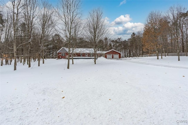 view of yard layered in snow