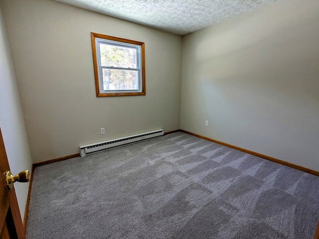 unfurnished room featuring carpet flooring, a textured ceiling, and baseboard heating