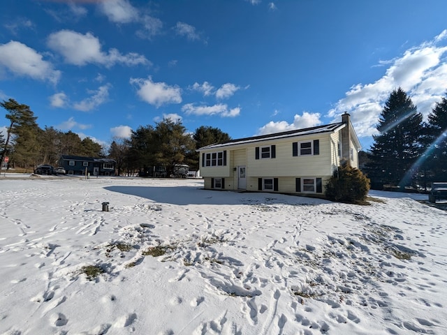 view of snow covered house