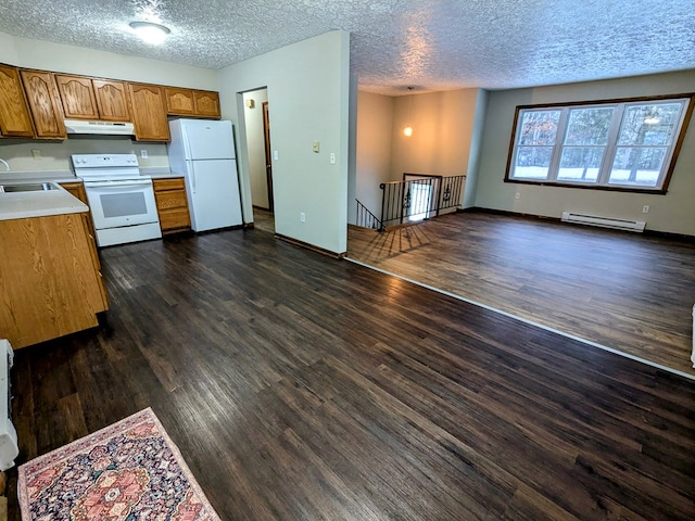 kitchen with dark hardwood / wood-style floors, sink, a baseboard heating unit, white appliances, and a textured ceiling