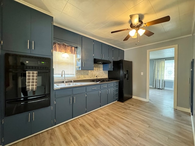 kitchen featuring sink, ornamental molding, black appliances, and light wood-type flooring