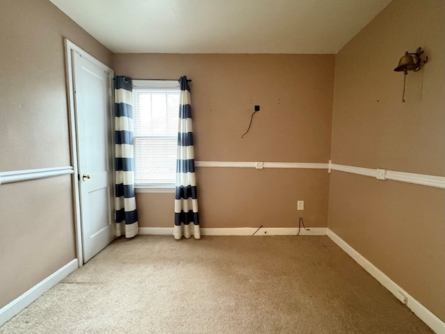 unfurnished room featuring carpet