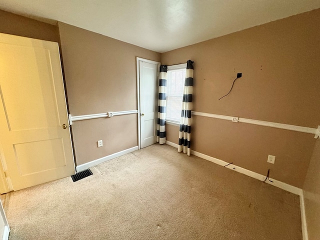 unfurnished bedroom with carpet flooring