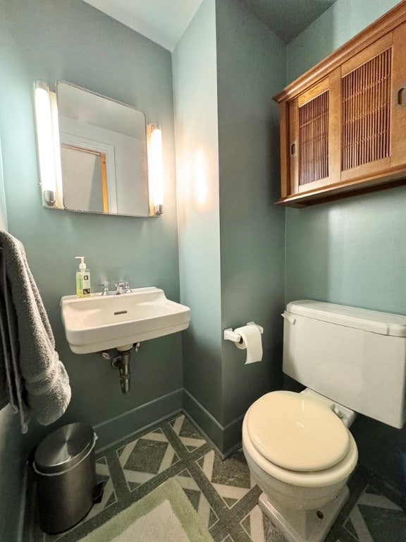 bathroom with sink and toilet