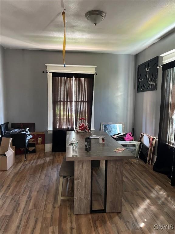 dining area with dark wood-type flooring