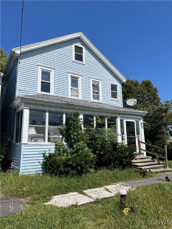 view of front facade featuring a sunroom