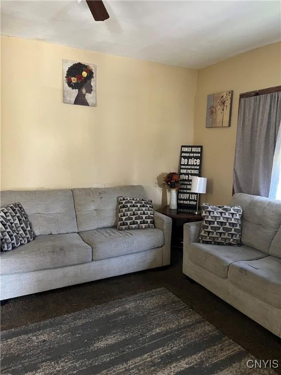 living room featuring ceiling fan