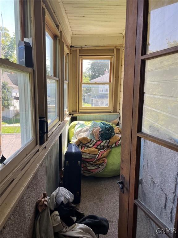 sunroom with wooden ceiling