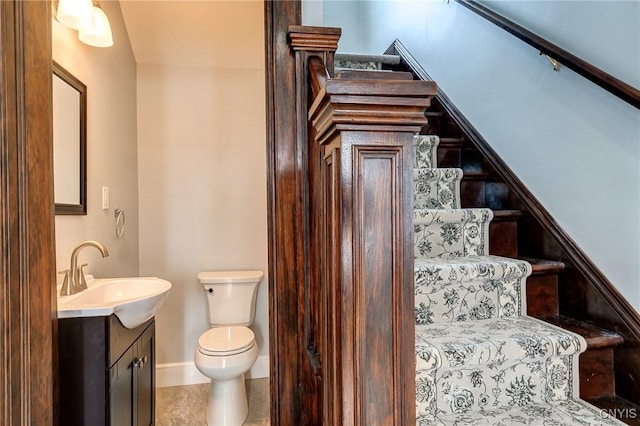 bathroom with vanity, toilet, and tile patterned flooring