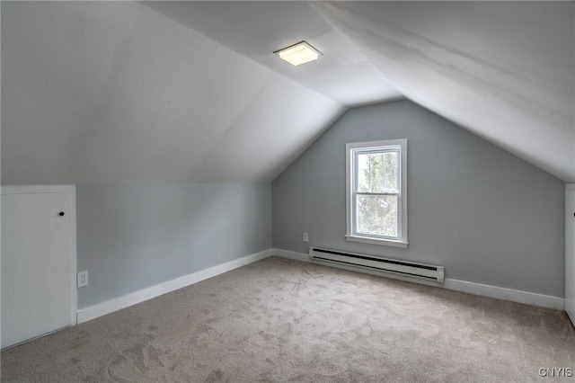 bonus room featuring a baseboard radiator, lofted ceiling, and light colored carpet