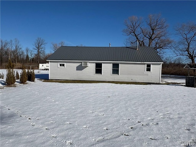 view of snow covered house