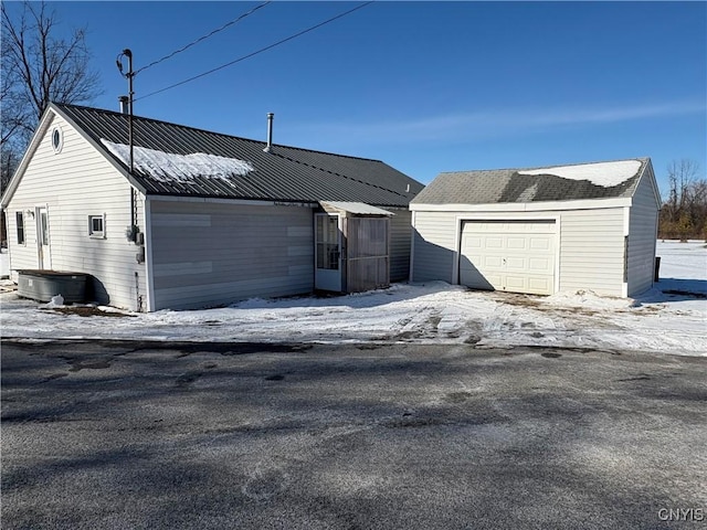 view of snow covered garage