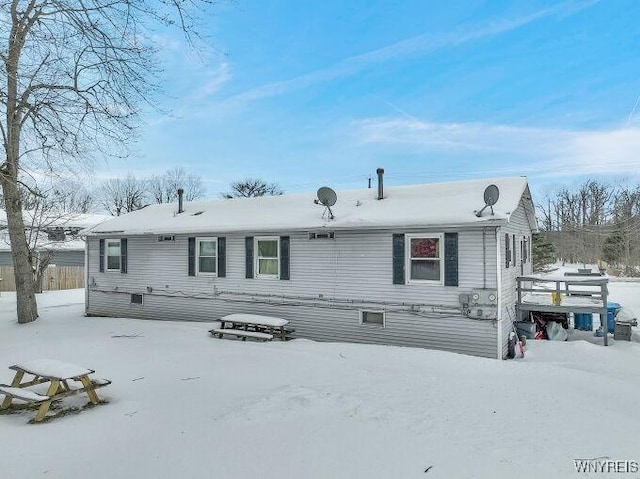 view of snow covered house