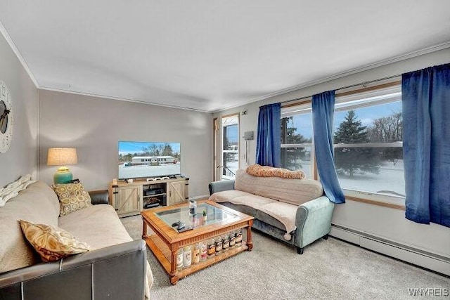 living room with a baseboard heating unit, ornamental molding, and carpet flooring