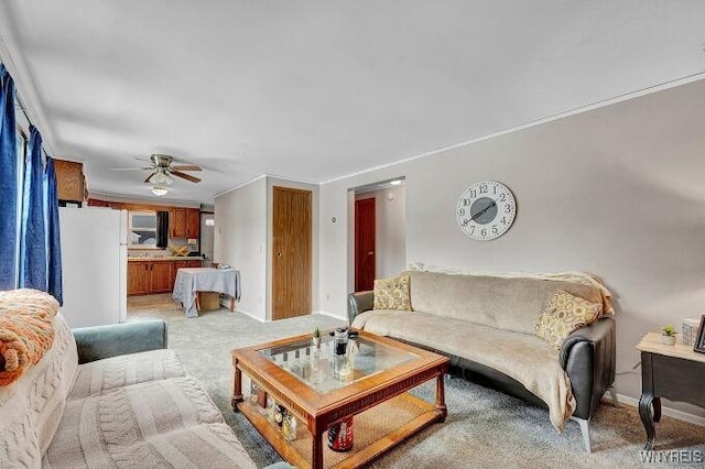 carpeted living room featuring ceiling fan