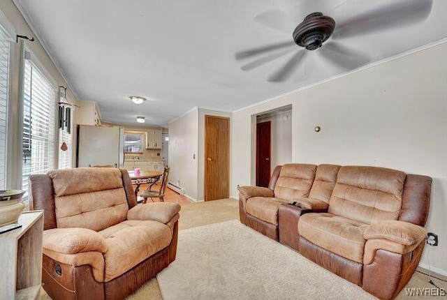 living room featuring ornamental molding, light colored carpet, and ceiling fan