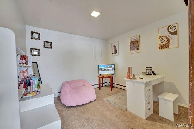 carpeted home office with baseboard heating