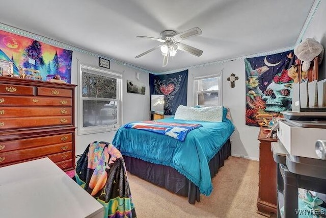 bedroom featuring light carpet and ceiling fan