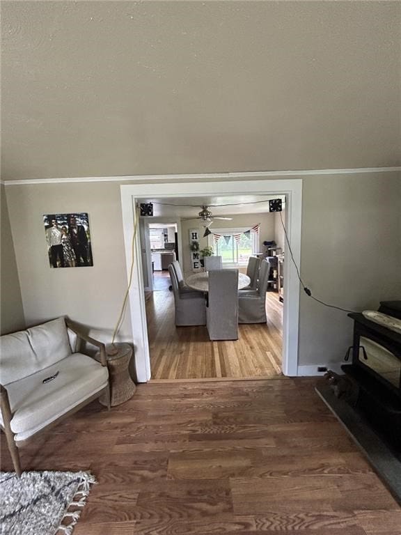 living room featuring crown molding and hardwood / wood-style floors